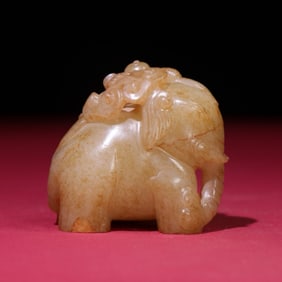 A Chinese Carved Jade Elephant and Boy Statuette