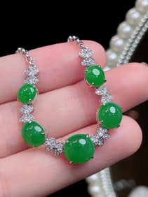 A Chinese Carved Jadeite Bracelet