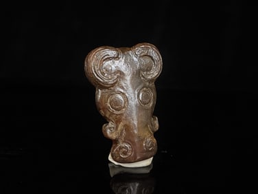 A Chinese Carved Jade Foo-Dog Pendant