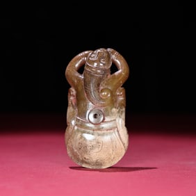 A Chinese Carved Jade Figure of Lying Man
