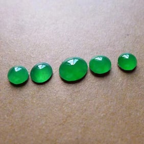 A Set of Chinese Carved Jadeite Pendants