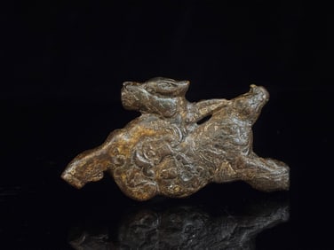 A Chinese Carved Jade Foo-Dog Statuette