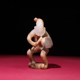 A Chinese Carved Jade Figure of Musician