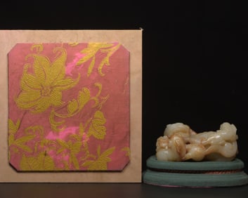 A Chinese Carved Jade Foo-Dog Statuette