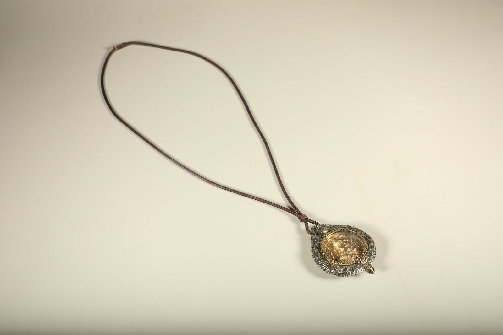 A Chinese Gilt Silver Figure of Buddha Necklace