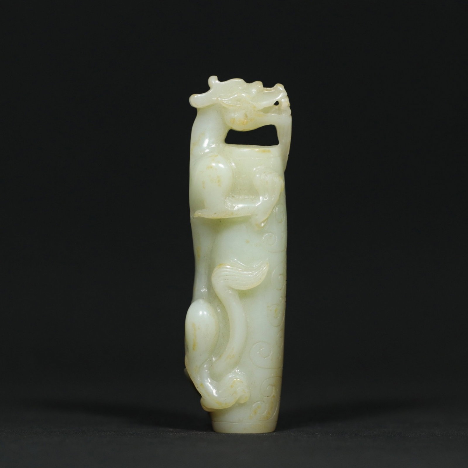 A Chinese Carved Jade Dragon Bead: Lg. 8.2cm, Wd. 2.3cm, Th. 2cm, Wt. 57.5g