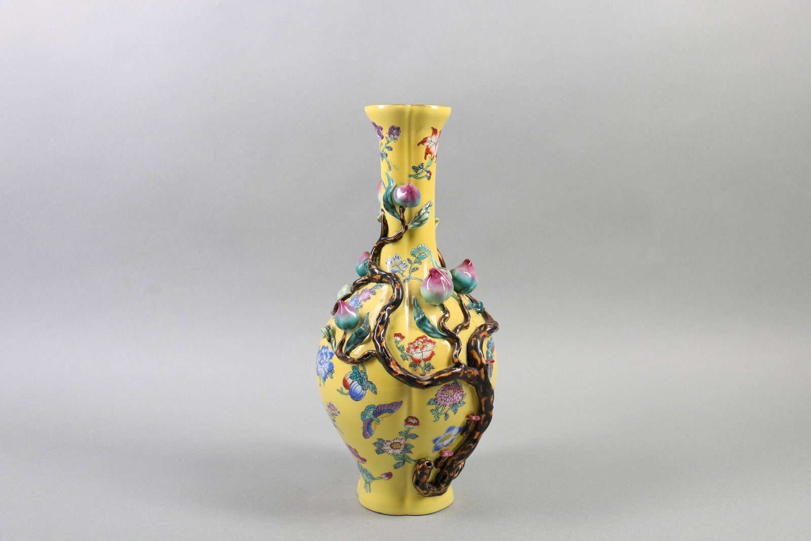 A Chinese Carved Yellow Ground Famille-Rose Porcelain Vase: Ht. 31cm
