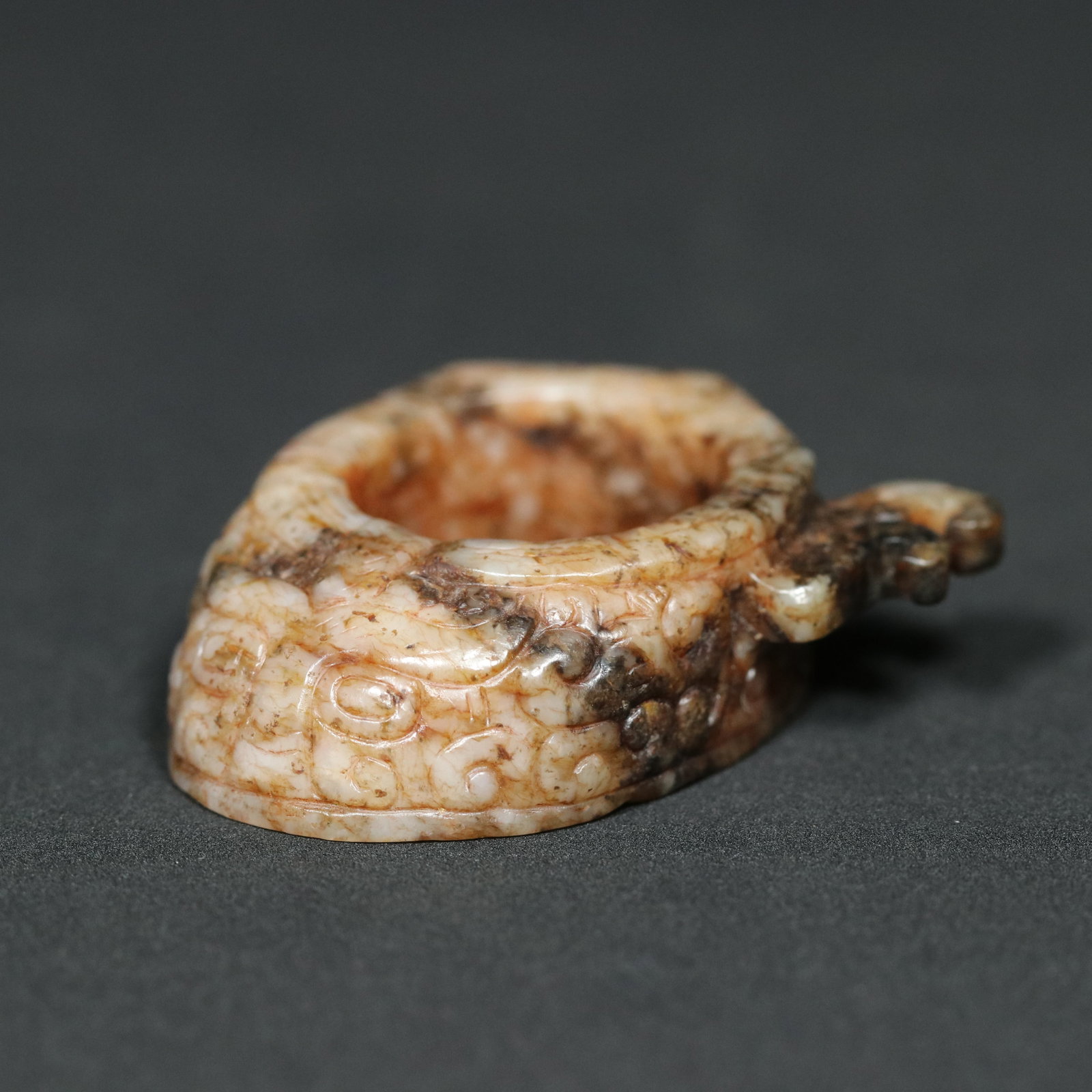 A Chinese Carved Jade Dragon Ring