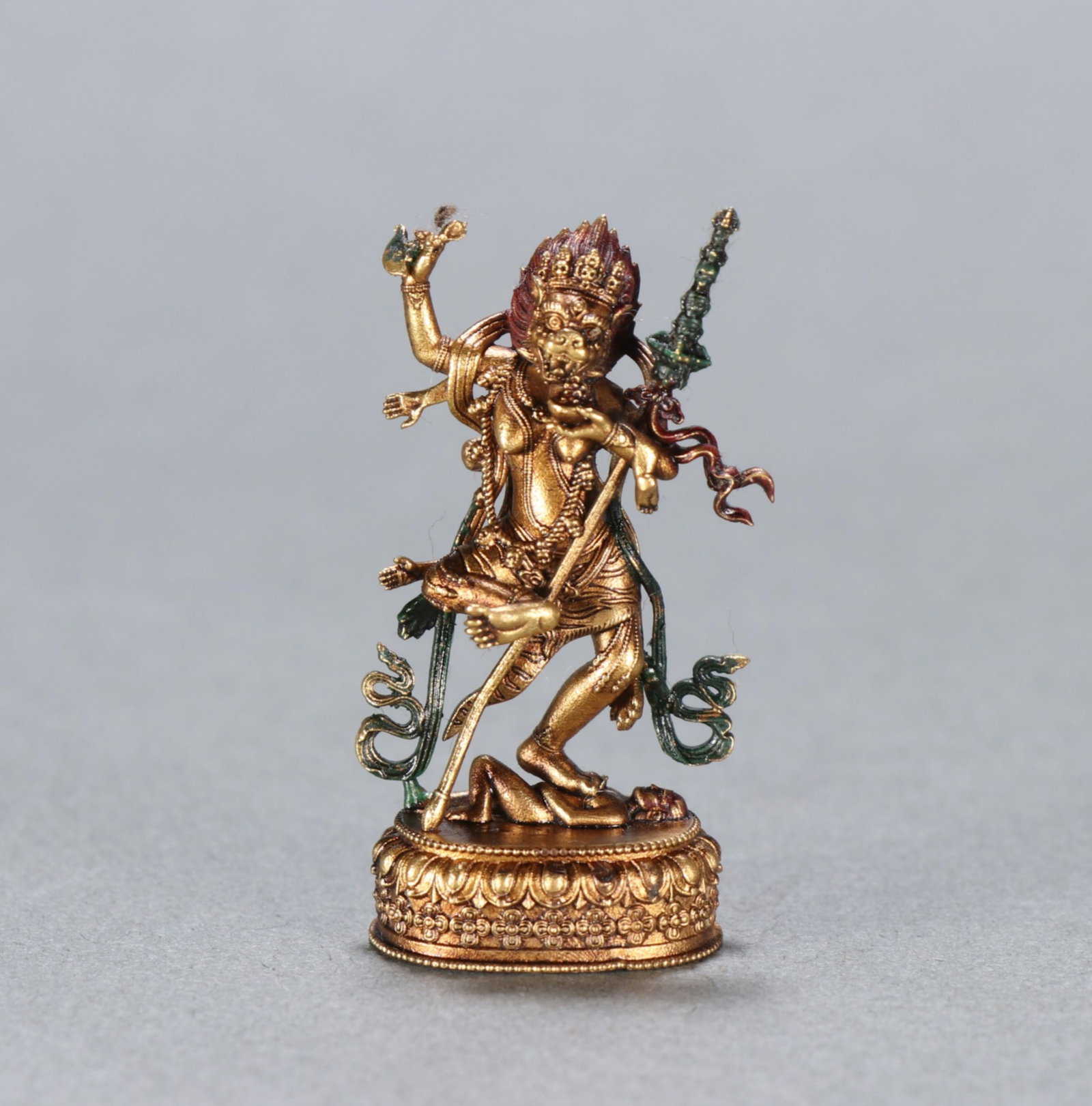 A Chinese Gilt Bronze Figure of Buddha: Ht. 3.8cm, Wd. 2.1cm, Wt. 10.6g