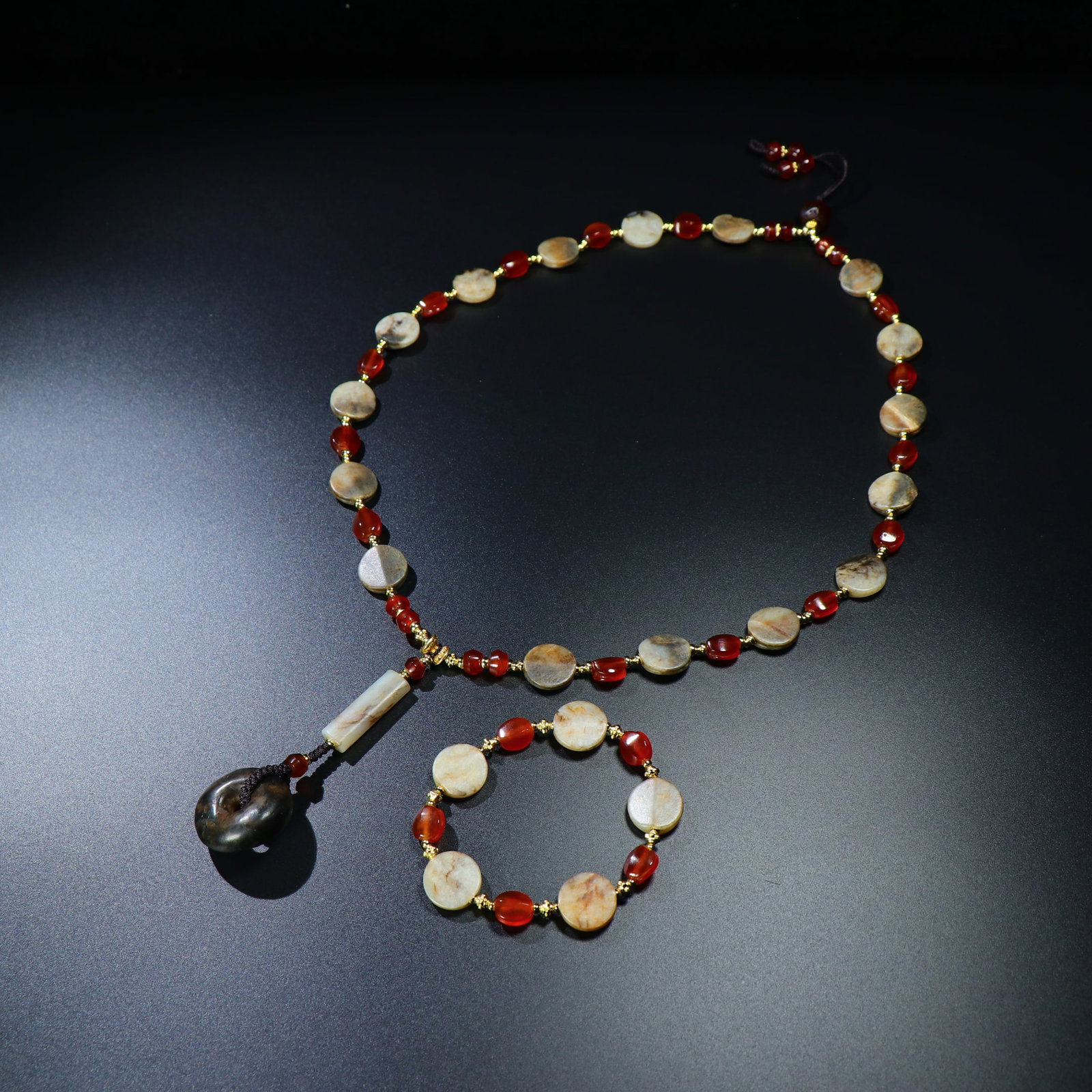 A Chinese Carved Jade Prayers Beads: Ht. 44cm, Diam. 1.7cm, Wt. 119g