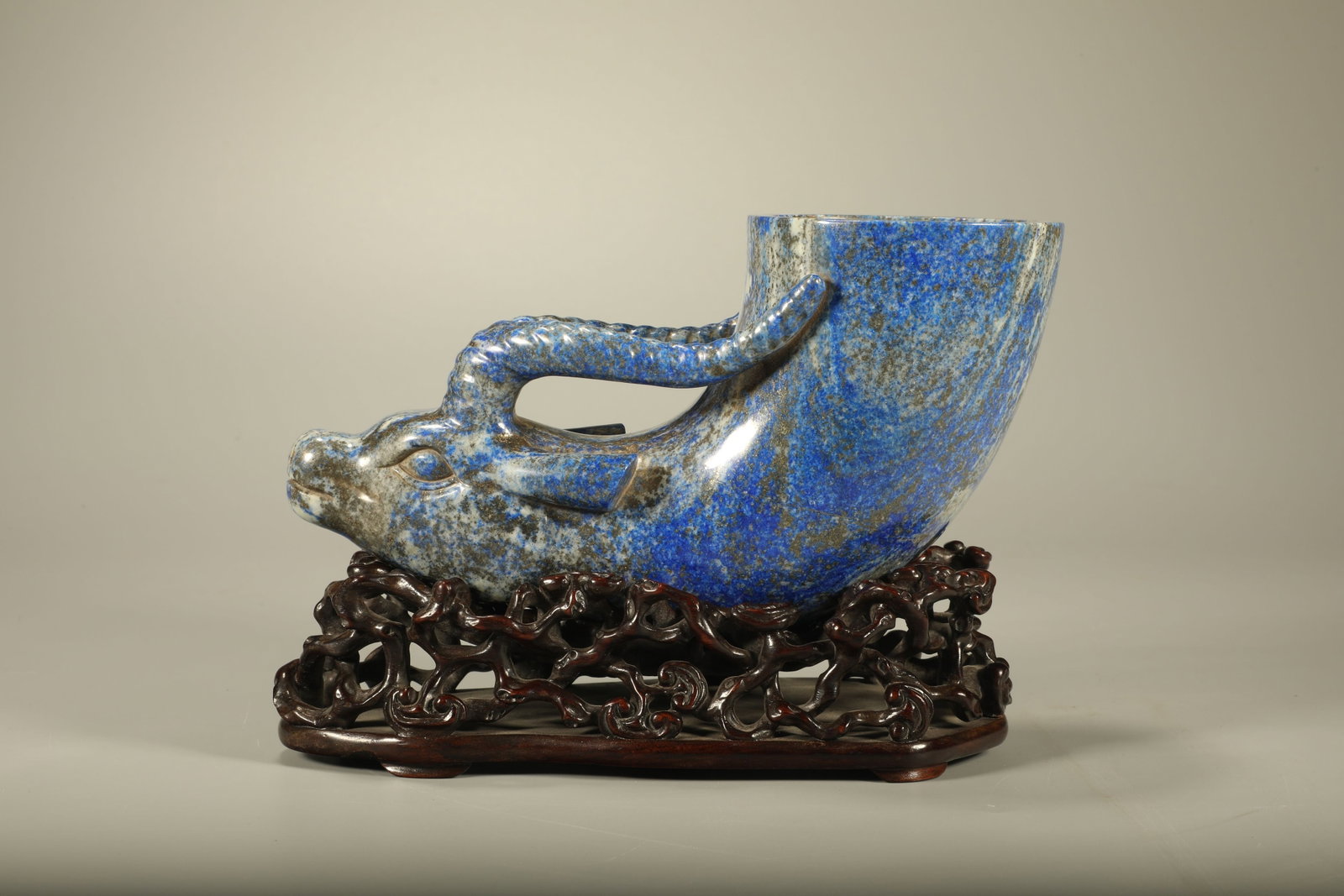 A Chinese Carved Lapis Lazuli Cup with Stand: Lg. 18cm, Wd. 8cm, Ht. 13.5cm