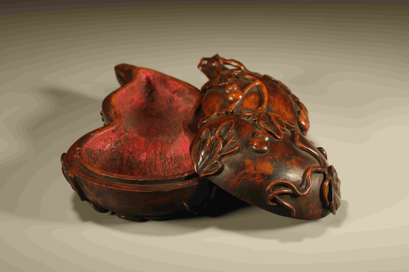 A Chinese Carved Hardwood Double-Gourd Box with Lid: Lg. 17.5cm, Wd. 10cm, Ht. 6.3cm