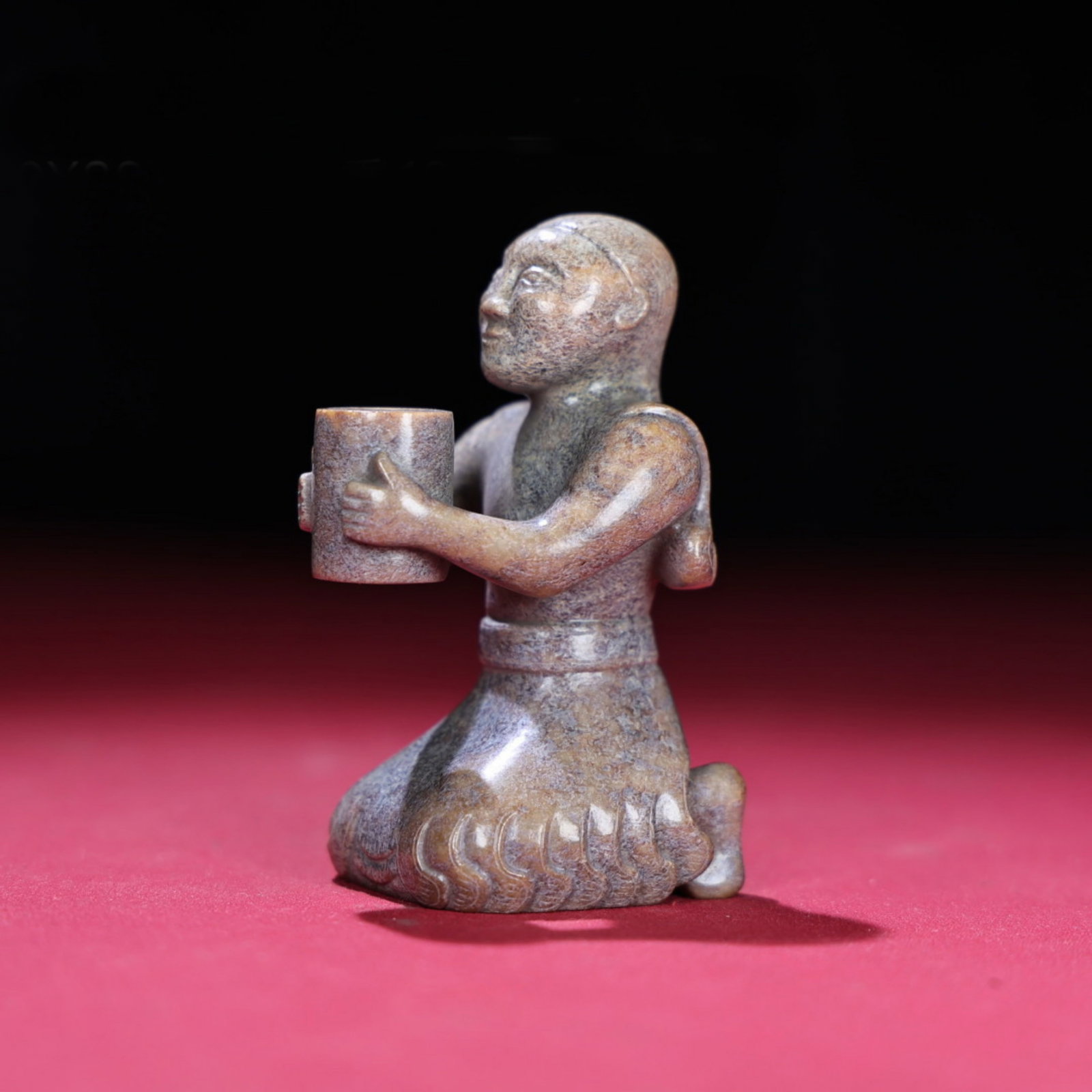 A Chinese Carved Jade Figure of Kneeling Man: Ht. 5cm, Wd. 8.8cm, Th. 4.2cm, Wt. 184g