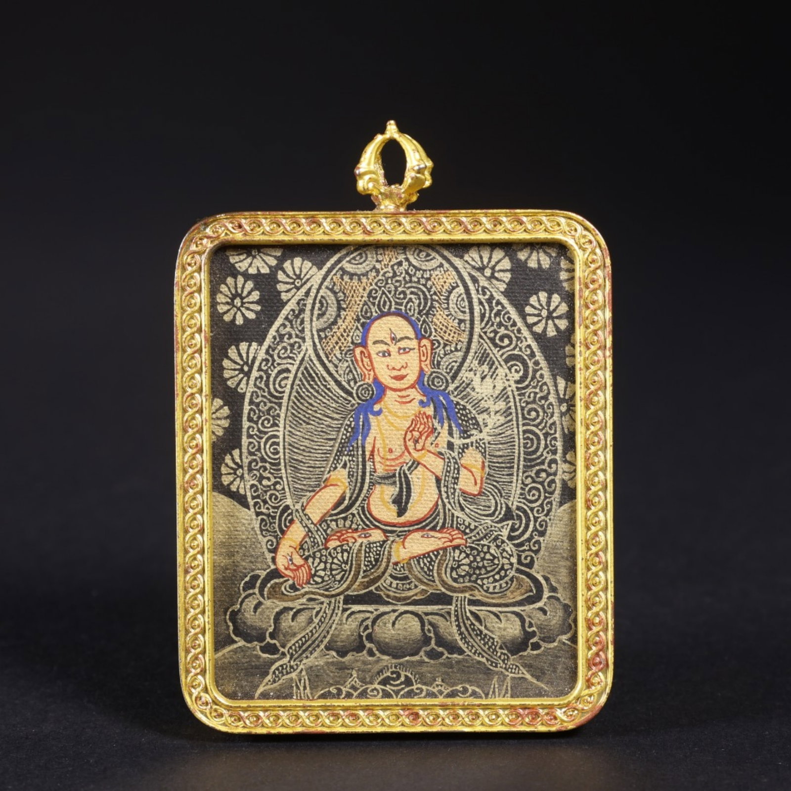 A Chinese Tangka with Gilt Bronze Framed Pendant: Lg. 5.5cm, Wd. 4.6cm, Th. 0.7cm, Wt. 40g