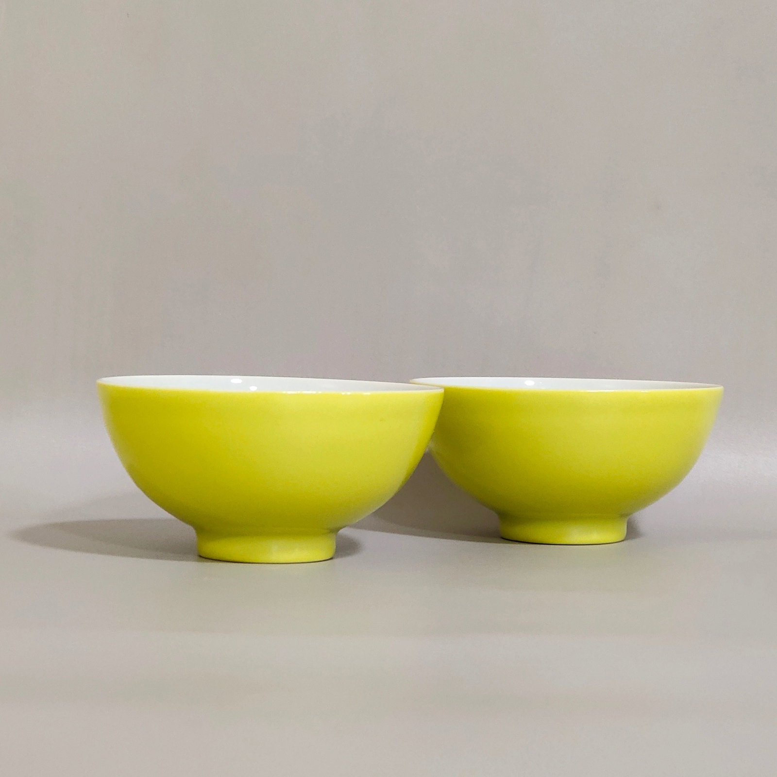 A Pair of Chinese Lemon-Yellow Glazed Porcelain Cups: Ht. 3.2cm, Diam. 6.2cm