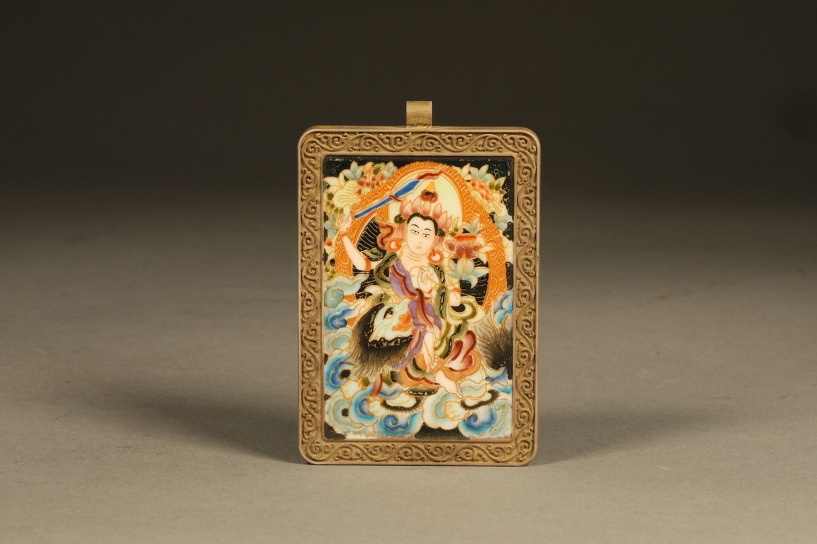 A Chinese Tangka with Gilt Bronze Framed Pendant: Lg. 6.5cm, Wd. 4.3cm, Th. 0.5cm