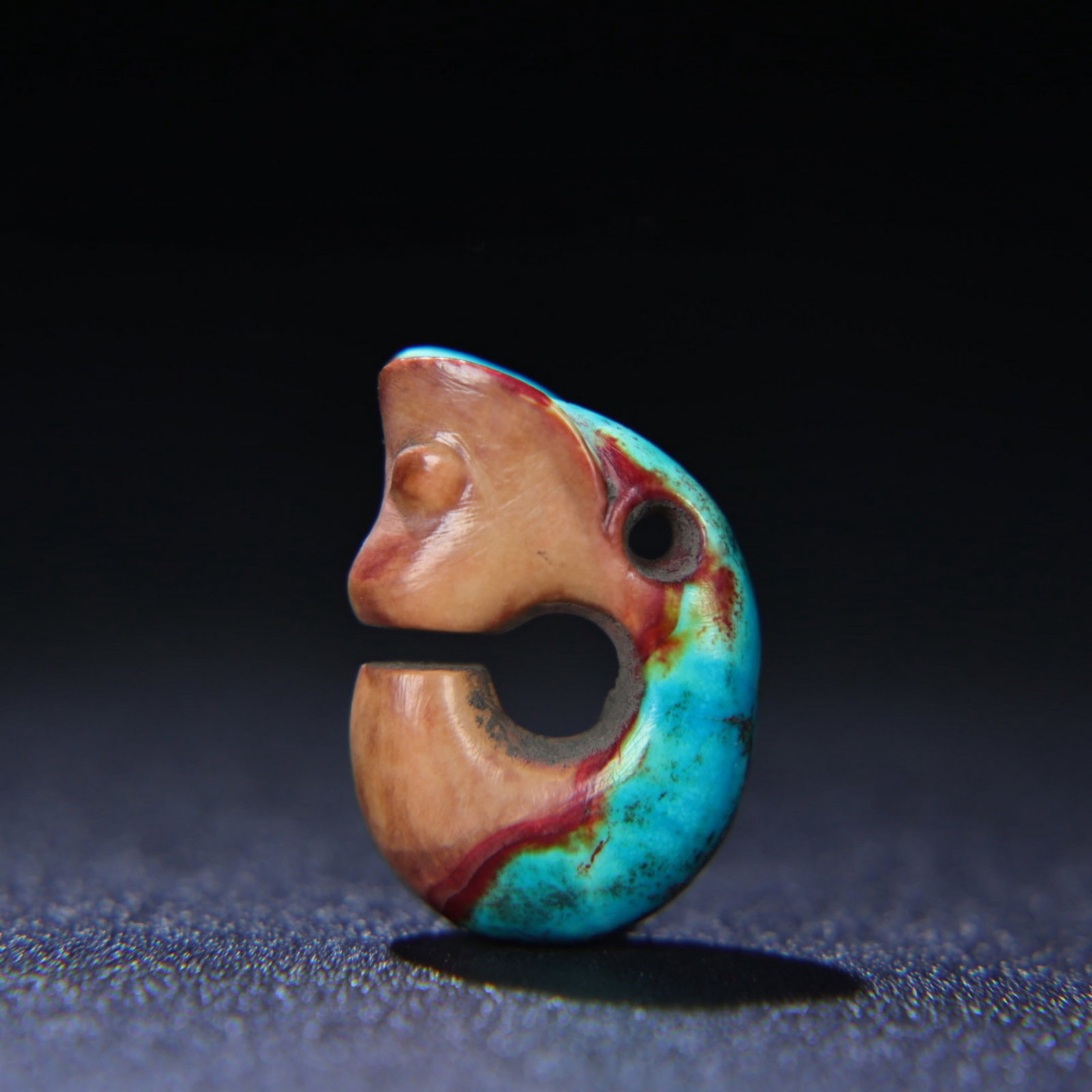A Chinese Carved Turquoise Dragon Pendant: Ht. 2.8cm, Wd. 2cm, Th. 0.9cm, Wt. 6g