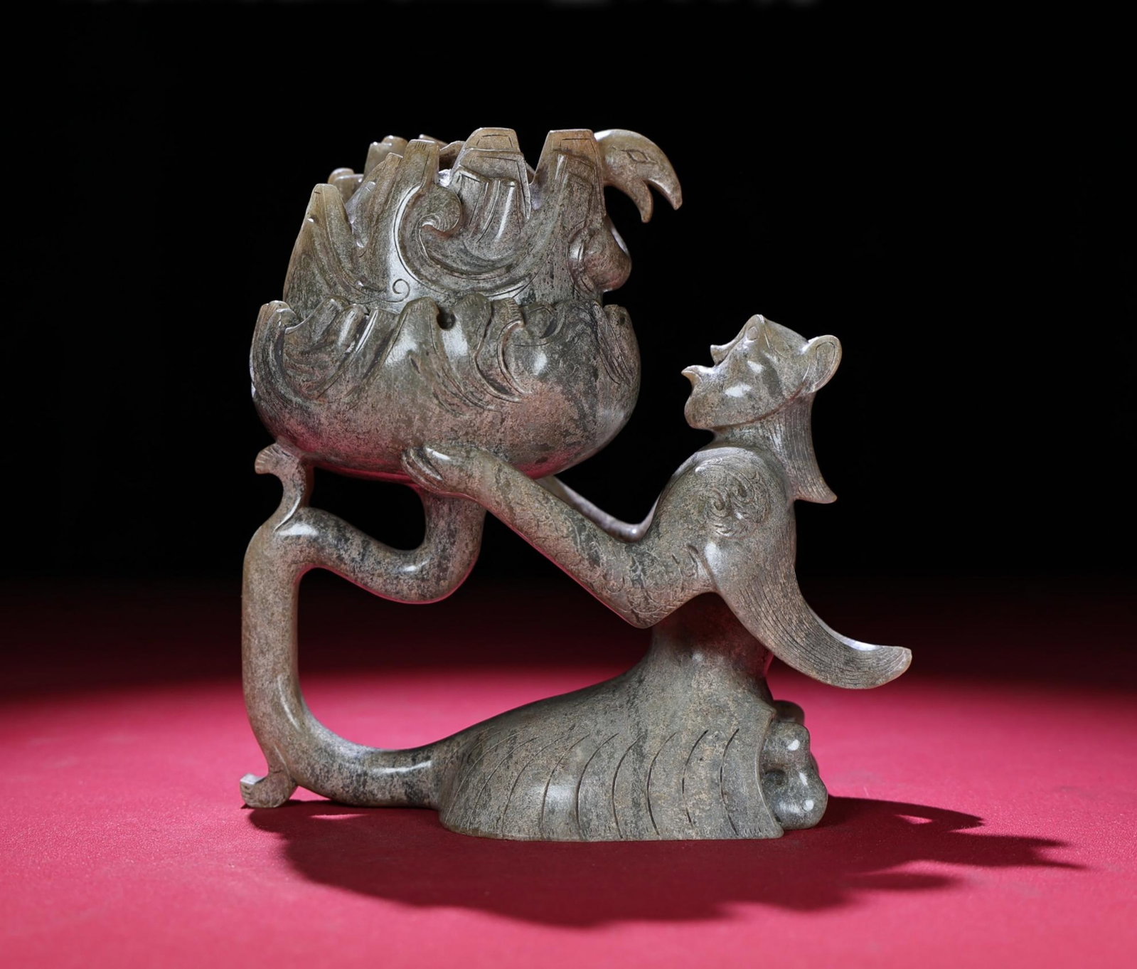 A Chinese Carved Jade Kneeling Man Incense Burner: Ht. 13.6cm, Wd. 13.2cm, Th. 7cm, Wt. 790g