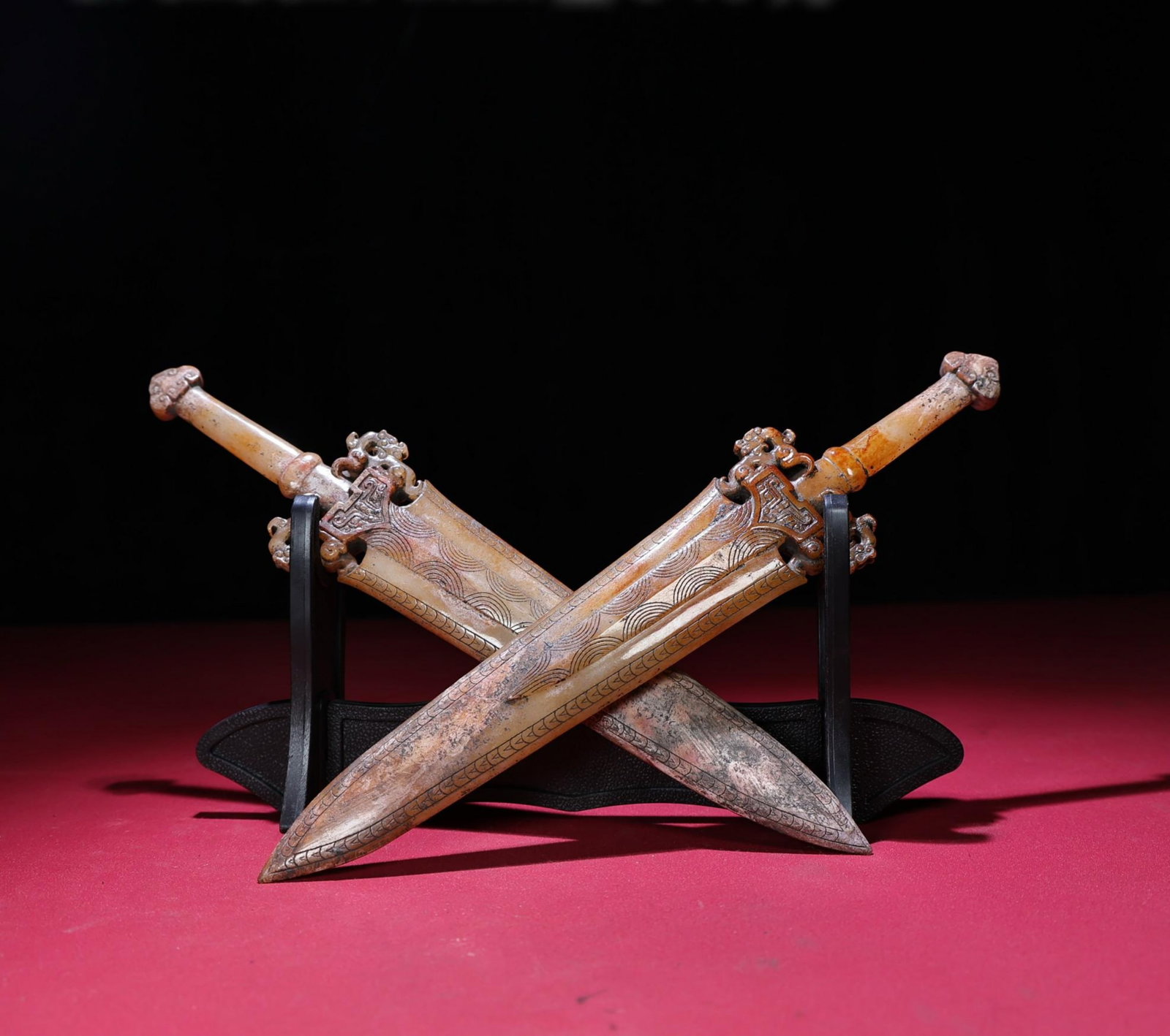 A Pair of Chinese Carved Jade Sword Pendants: Lg. 27.5cm, Wd. 5.8cm, Th. 1.4cm, Wt. 340g