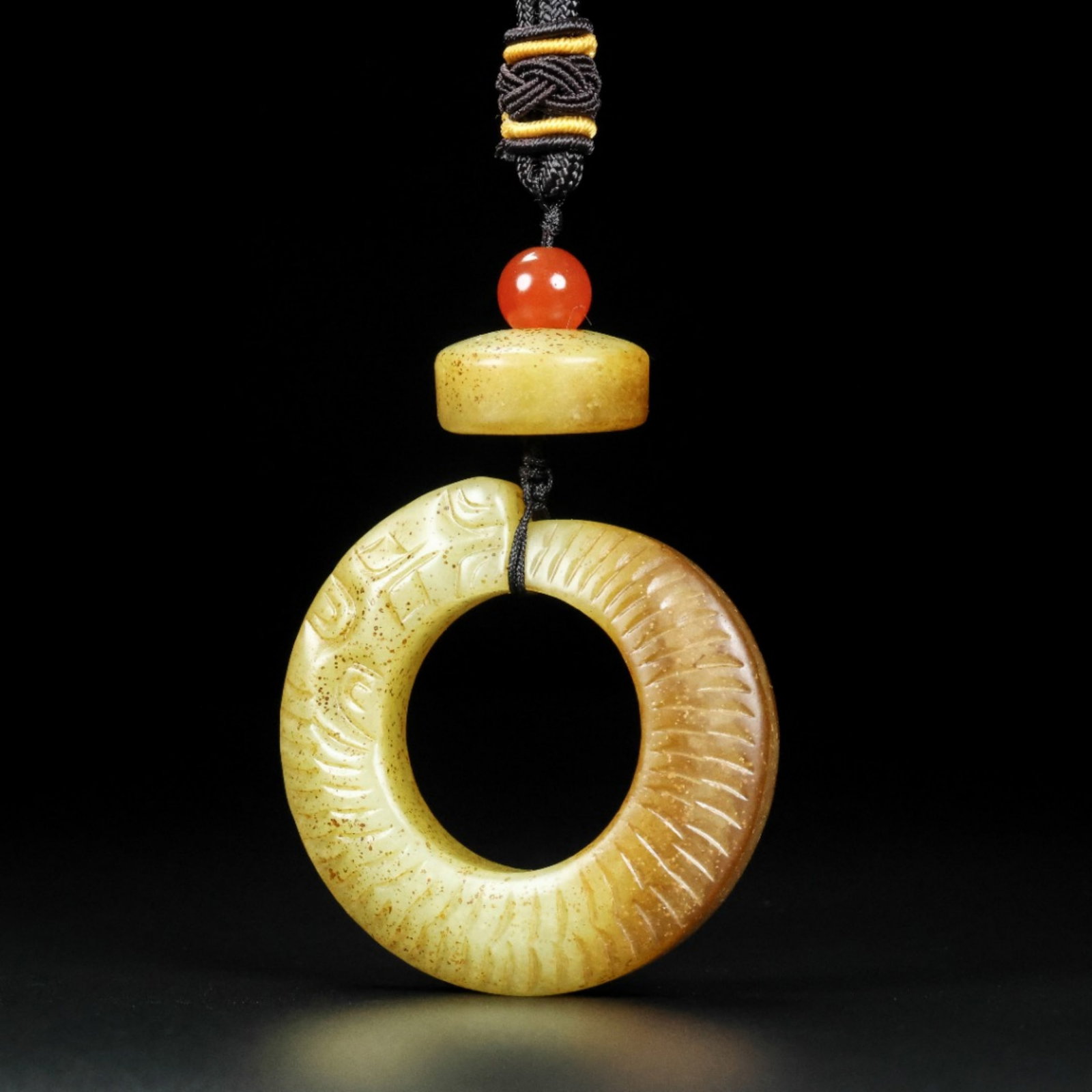 A Chinese Carved Jade Ring Pendant Set: Lg. 5.5cm, Wd. 5.5cm, Ht. 1cm, Wt. 55g