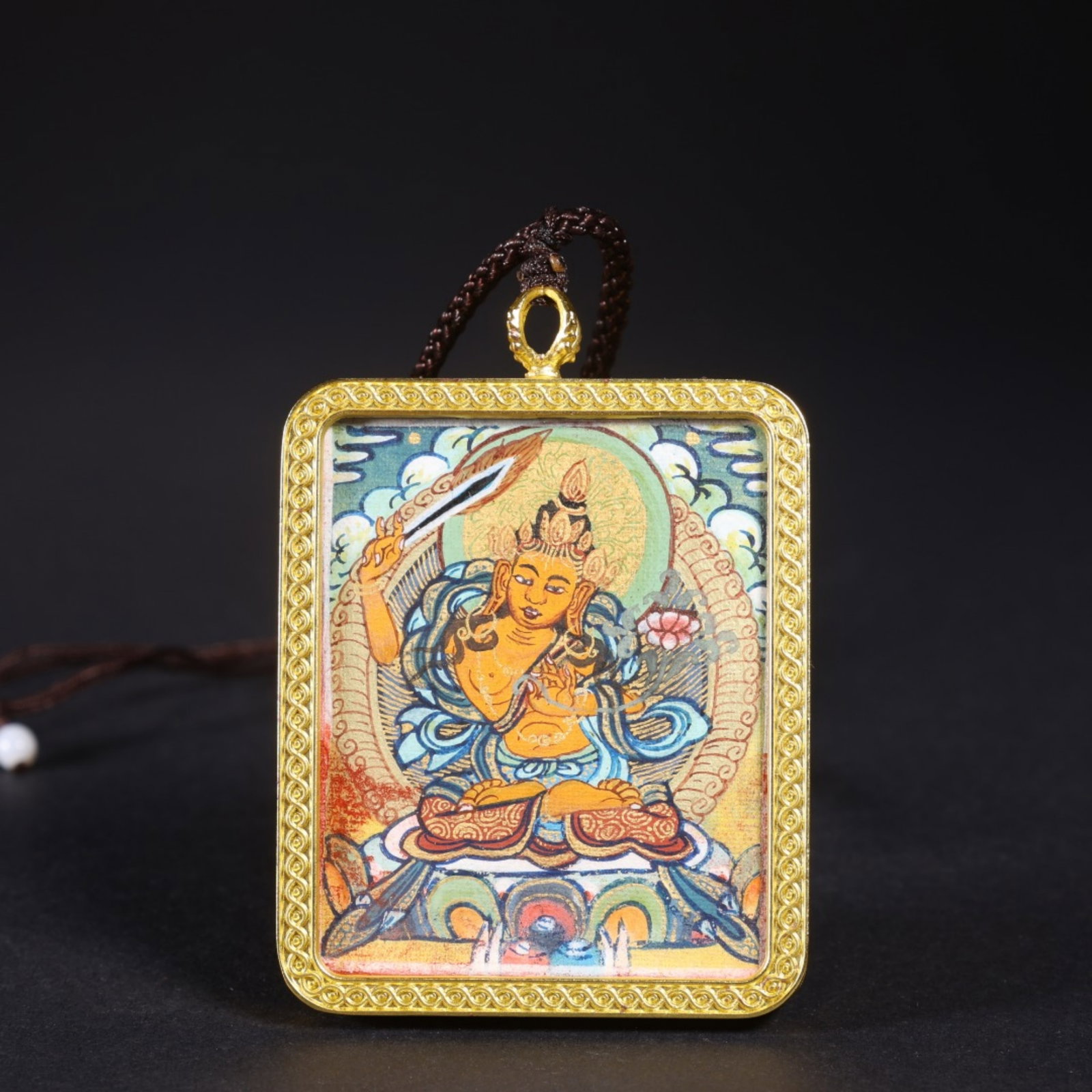 A Chinese Tangka with Gilt Bronze Framed Pendant: Lg. 5.5cm, Wd. 4.6cm, Th. 0.7cm, Wt. 36g