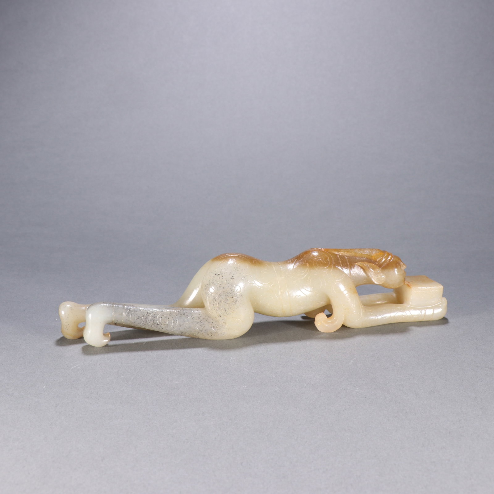 A Chinese Carved Jade Figure of Kneeling Man: Ht. 7.5cm, Wd. 21.8cm, Wt. 347.3g
