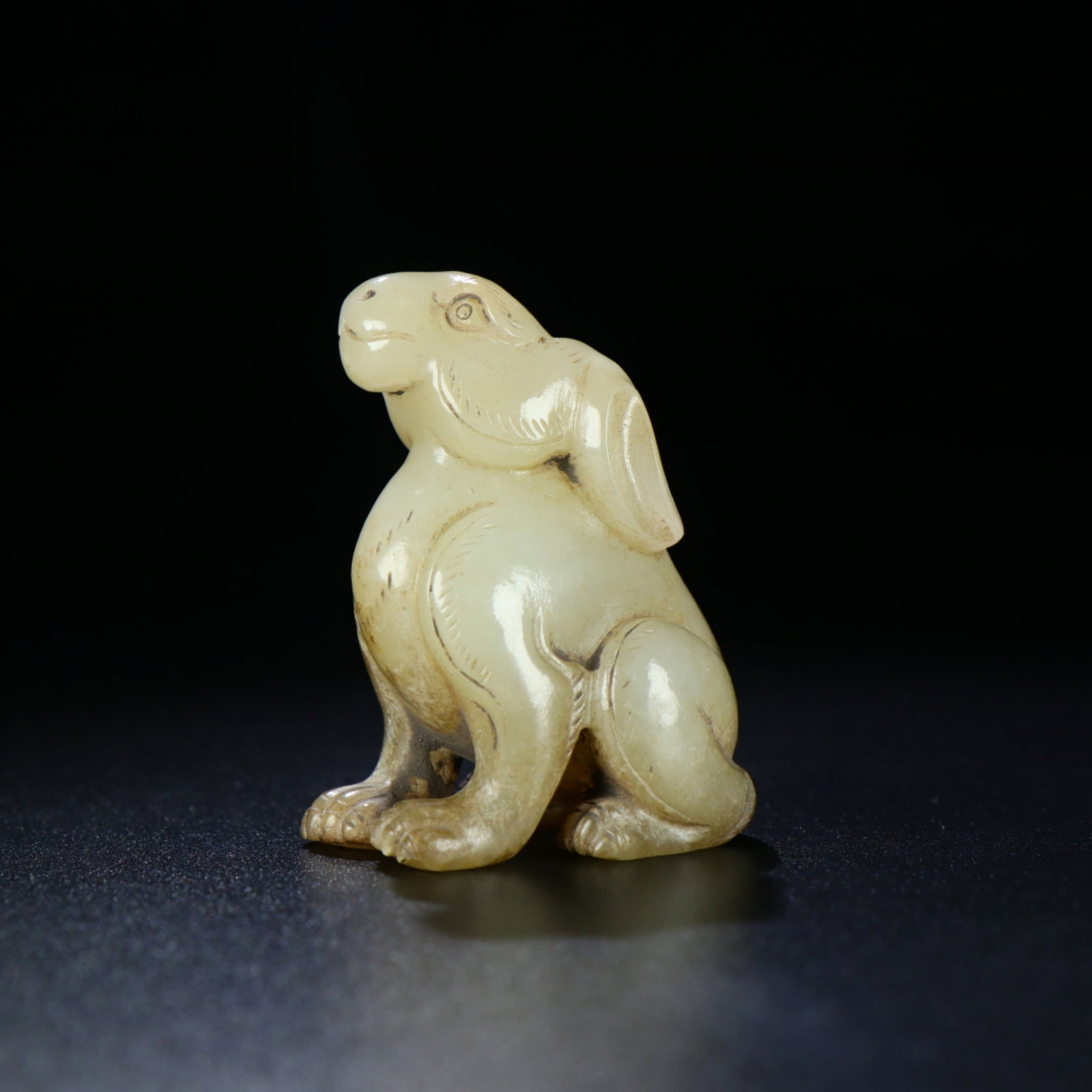 A Chinese Carved Jade Foo-Dog Statuette: Ht. 8cm, Wd. 4.5cm, Wt. 92g