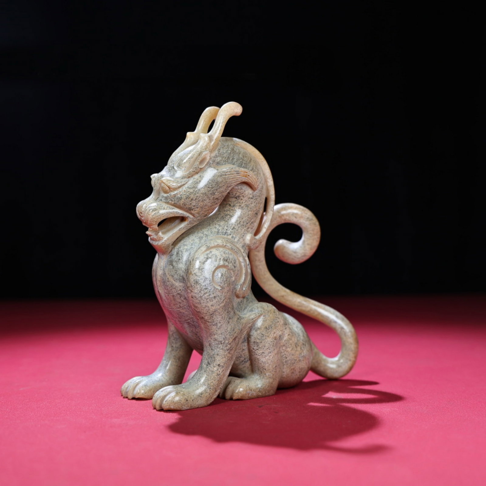 A Chinese Carved Jade Foo-Dog Statuette: Ht. 15.5cm, Wd. 13cm, Th. 5.5cm, Wt. 539g