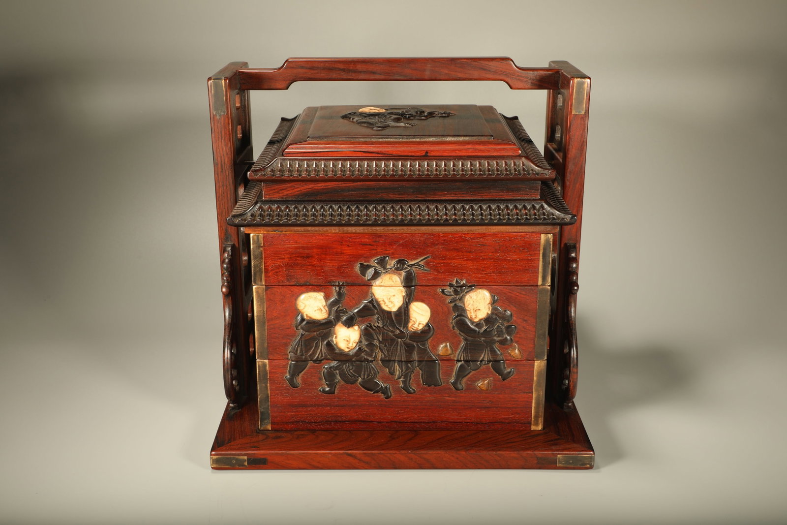 A Chinese Carved Hardwood Multi-Layer Box with Handle: Wd. 32cm, Ht. 33cm