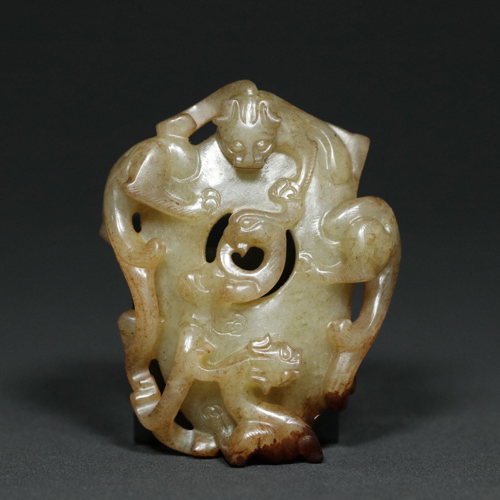 A Chinese Carved Jade Dragon Pendant: Lg. 7.4cm, Wd. 5.8cm, Th. 2cm, Wt. 83.5g