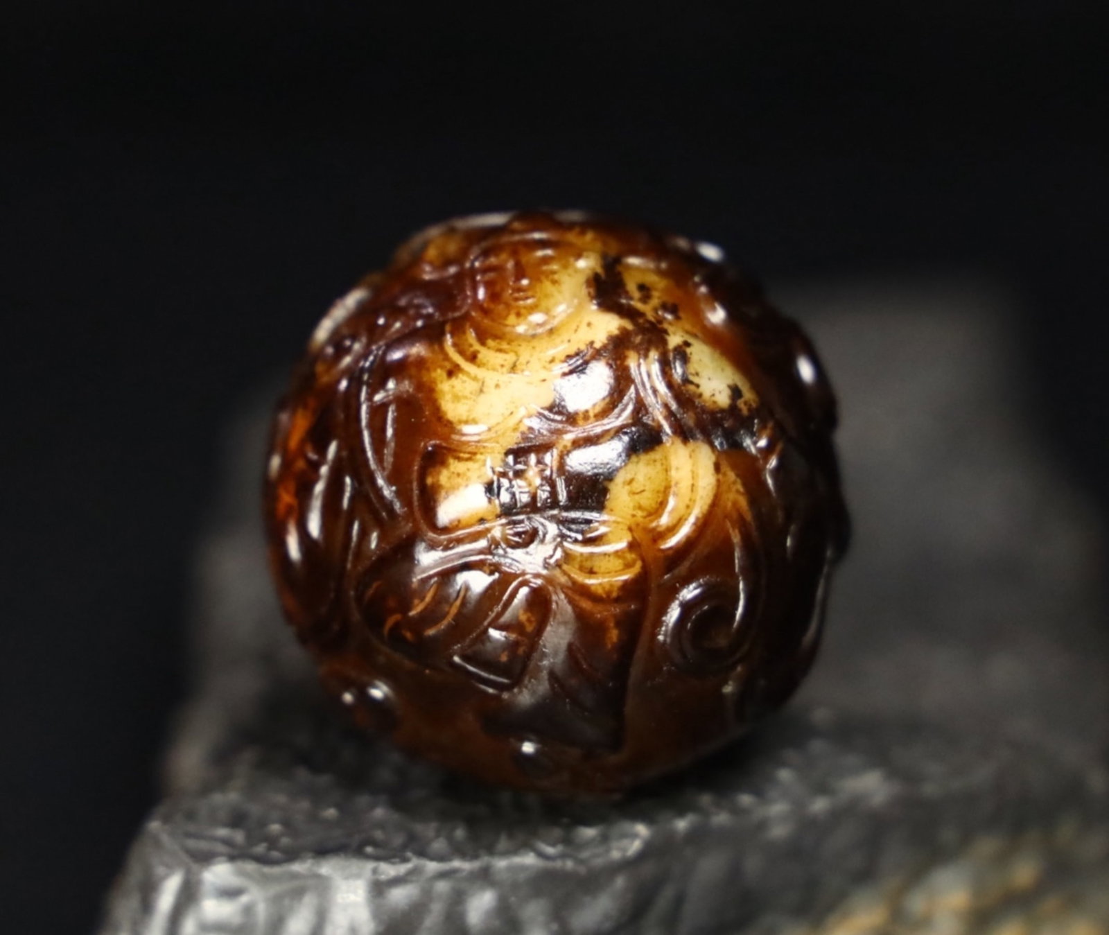 A Chinese Carved Jade Bead: Diam. 4cm, Wt. 79.5g