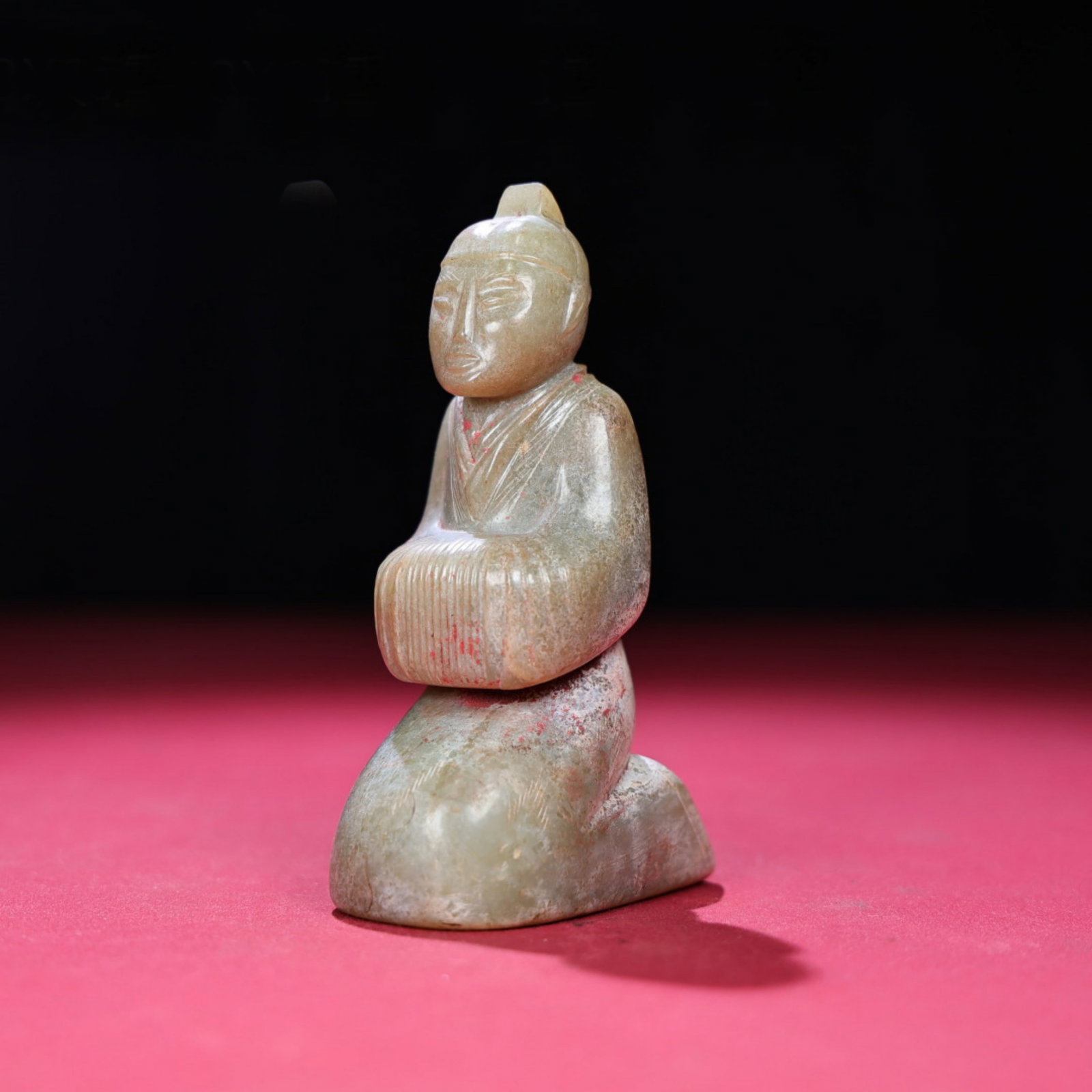 A Chinese Carved Jade Figure of Kneeling Man: Ht. 11.3cm, Wd. 6.5cm, Th. 4cm, Wt. 311g