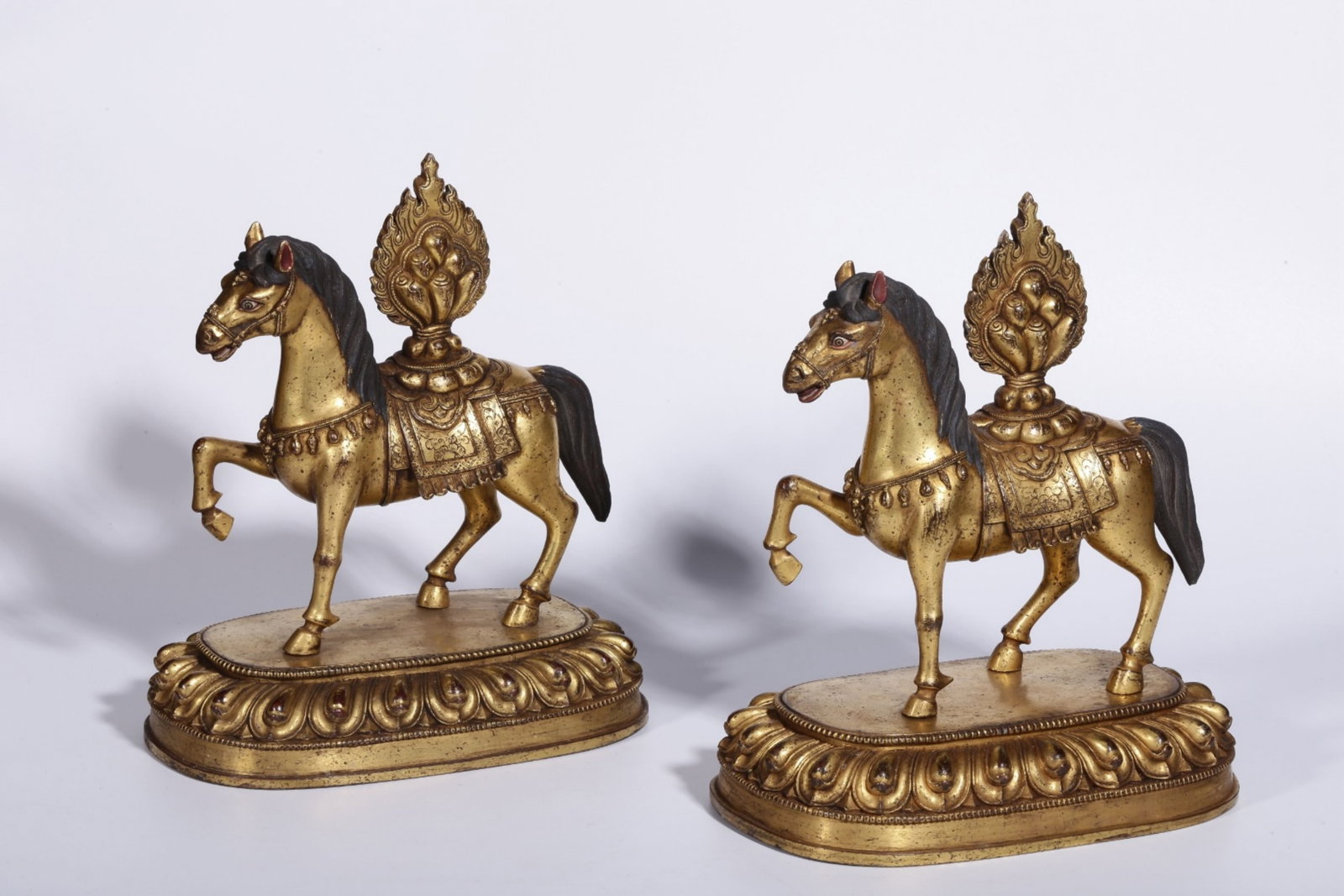 A Pair of Chinese Gilt Bronze Horse Statuettes: Ht. 23cm, Lg. 20cm, Wd. 12.5cm, Wt. 2379g, 2263g