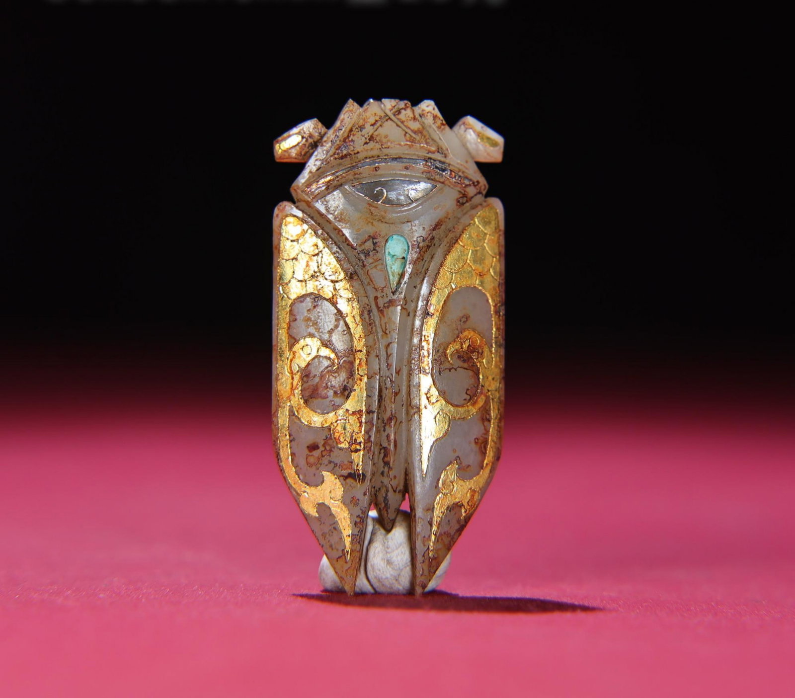 A Chinese Carved Jade Cicada Statuette: Ht. 6.3cm, Wd. 3cm, Th. 1cm, Wt. 26g