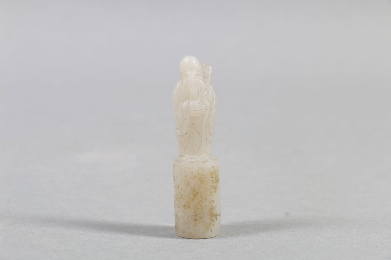 A Chinese Carved Jade Seal: Wt. 31g, Ht. 6.5cm