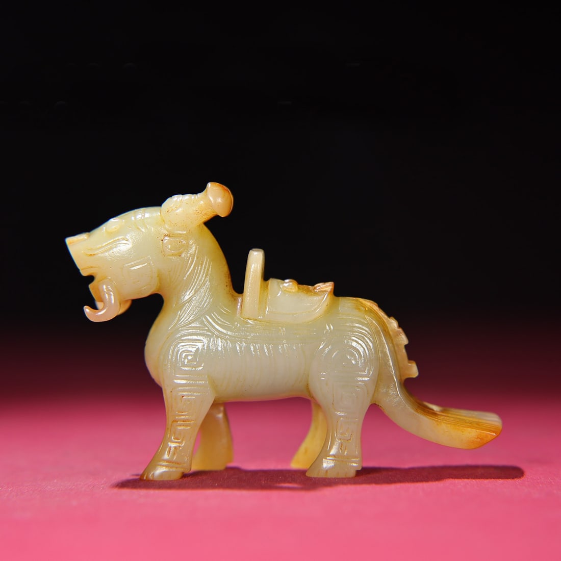 A Chinese Carved Jade Foo-Dog Statuette: Lg. 9.6cm, Wd. 2cm, Th. 6cm, Wt. 95g