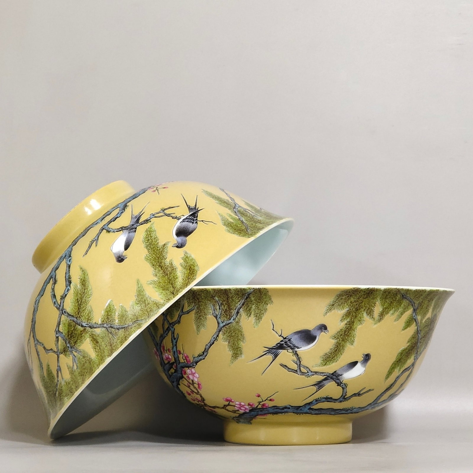 A Pair of Chinese Yellow Ground Famille-Rose Porcelain Bowls: Ht. 7.7cm, Diam. 16.7cm