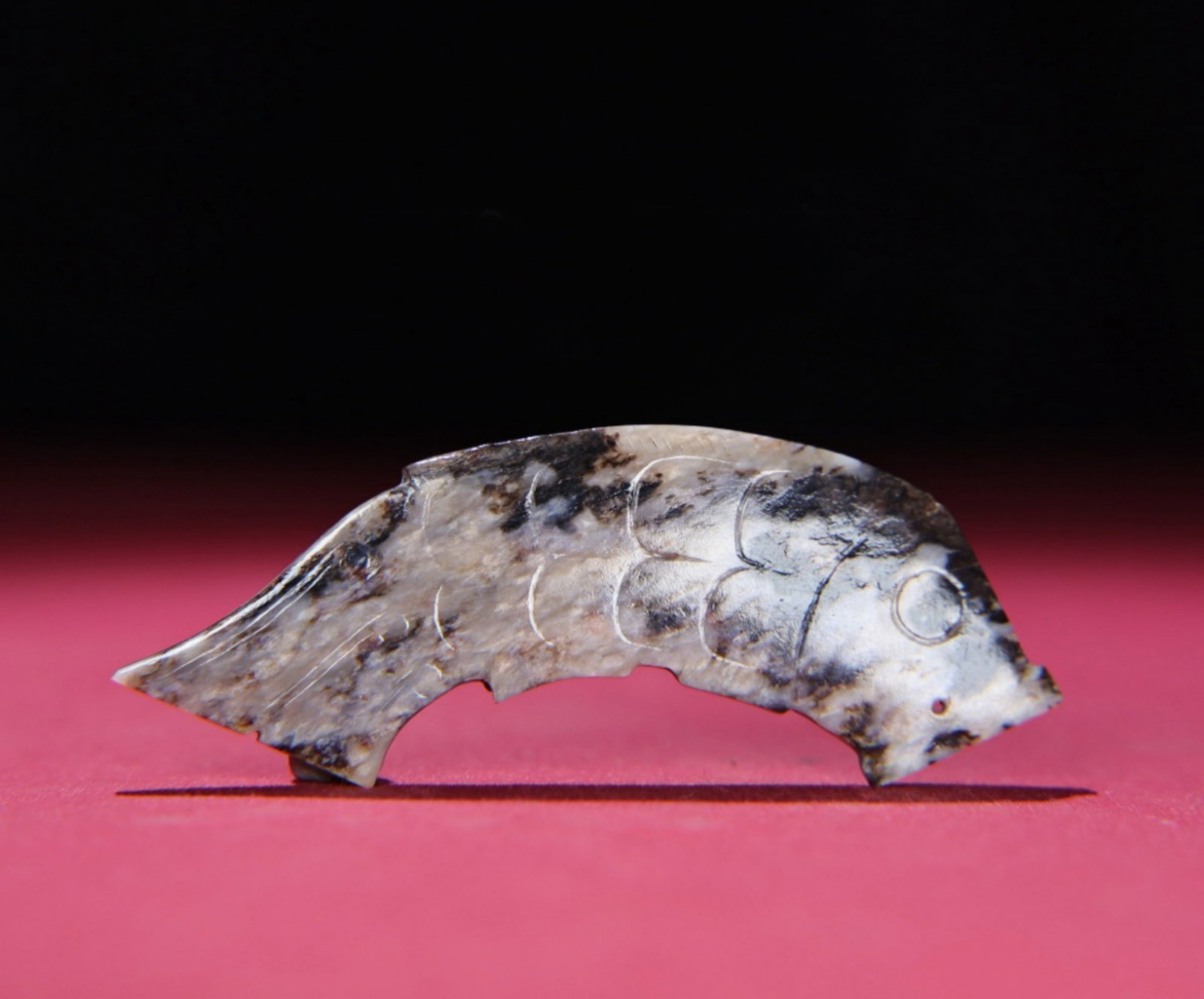 A Chinese Carved Jade Fish Pendant: Lg. 9.3cm, Wd. 3.5cm, Th. 0.6cm, Wt. 28g