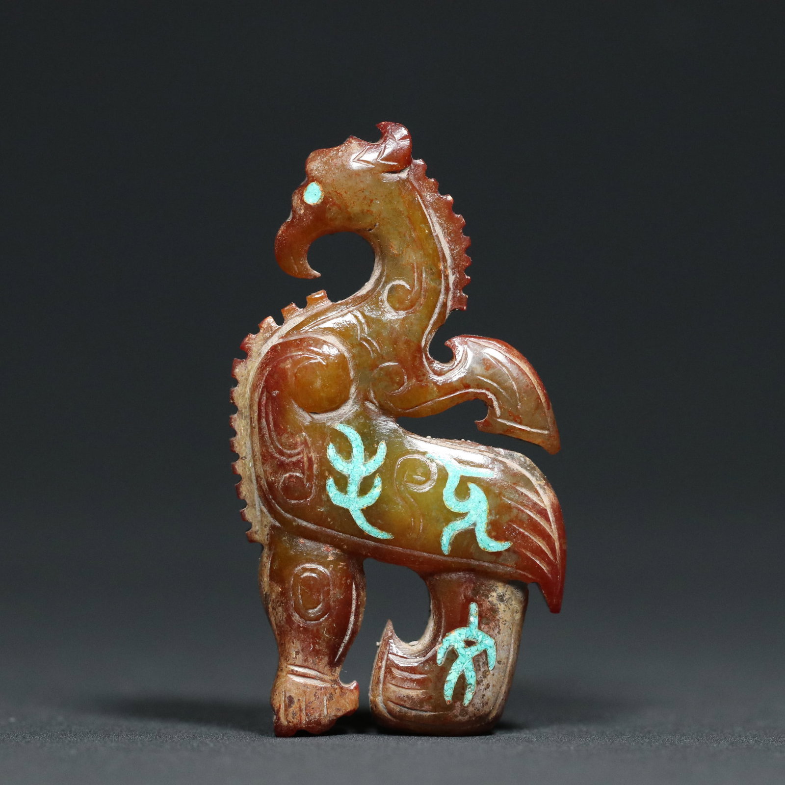 A Chinese Carved Jade Phoenix Statuette: Lg. 5.9cm, Wd. 3.2cm, Th. 1.2cm, Wt. 29.8g
