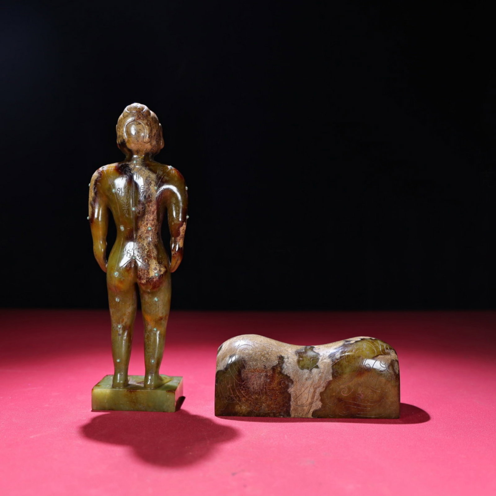 A Chinese Carved Jade Human Model and Pulse Pillow: Ht. 21.7cm, Wd. 6cm, Th. 4.1cm, Wt. 1401g, Multi-Sizes