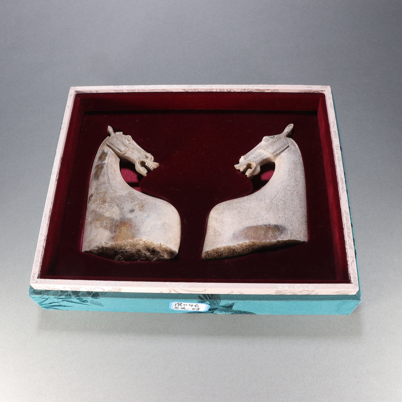 A Pair of Chinese Carved Jade Horse Head Pendants: Ht. 15.1cm, Wd. 9cm, Wt. 490g