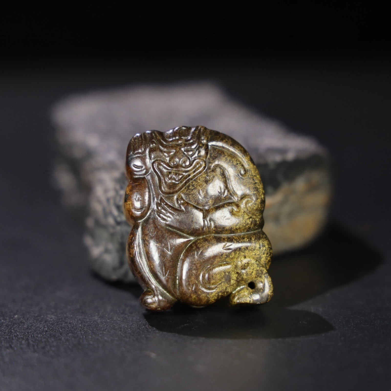 A Chinese Carved Jade Bear Pendant: Lg. 4.6cm, Wd. 3.6cm, Th. 1.7cm, Wt. 60g