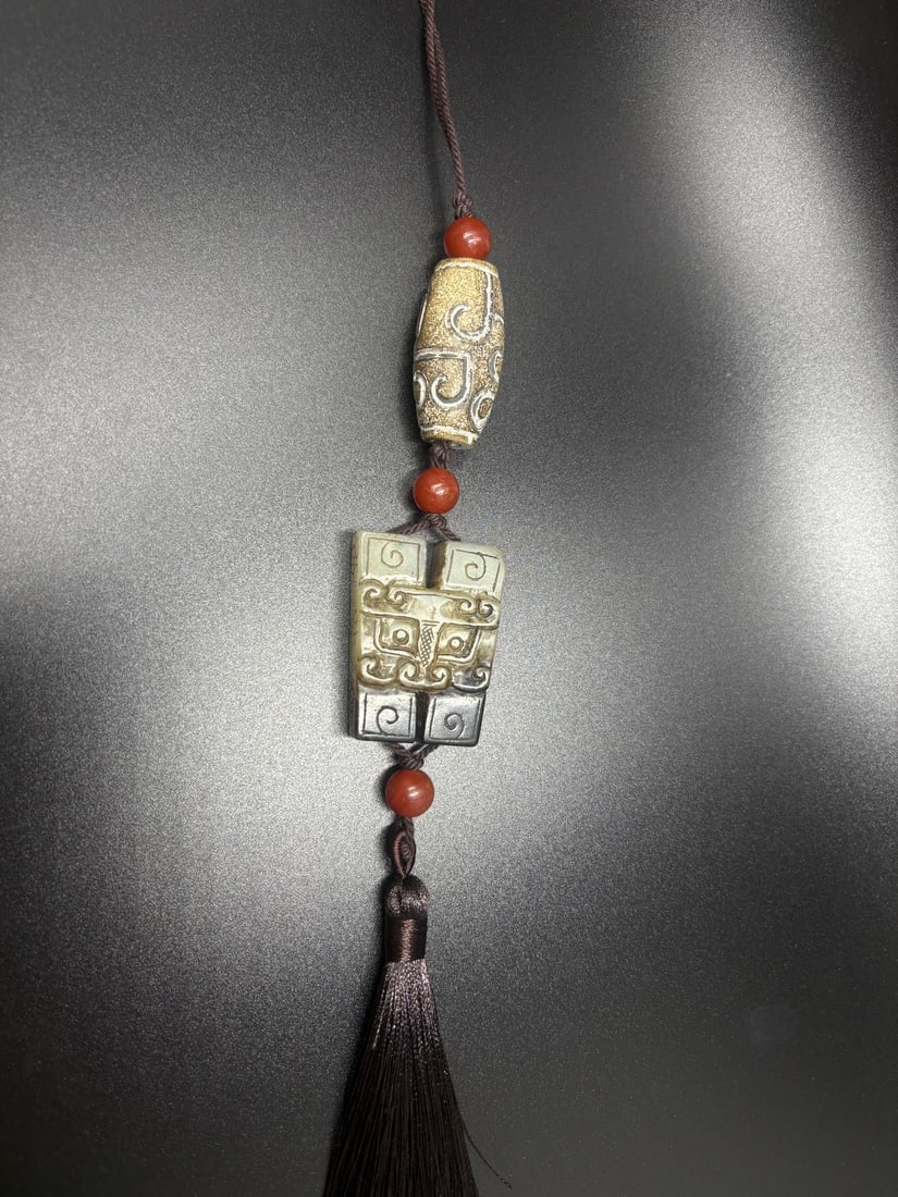 A Chinese Carved Jade Pendants Set: Ht. 4.1cm, Wd. 3cm, Th. 1.1cm, Wt. 34g