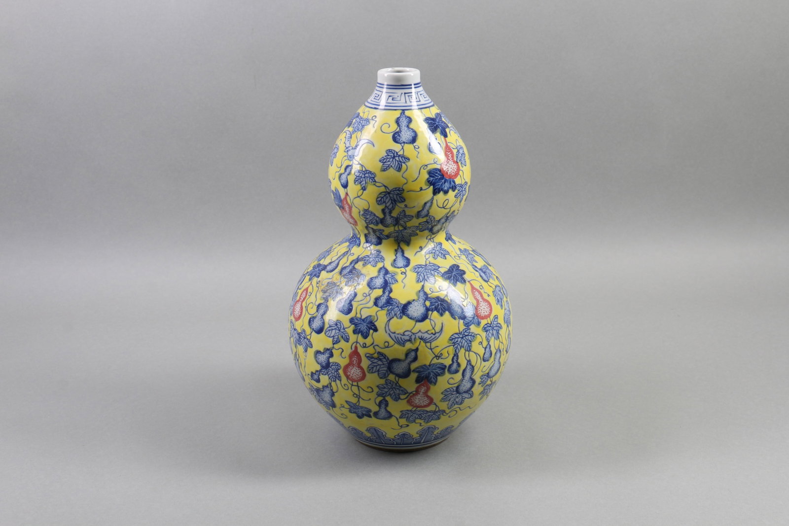 A Chinese Yellow Ground Famille-Rose Double-Gourd Porcelain Vase: Ht. 33cm