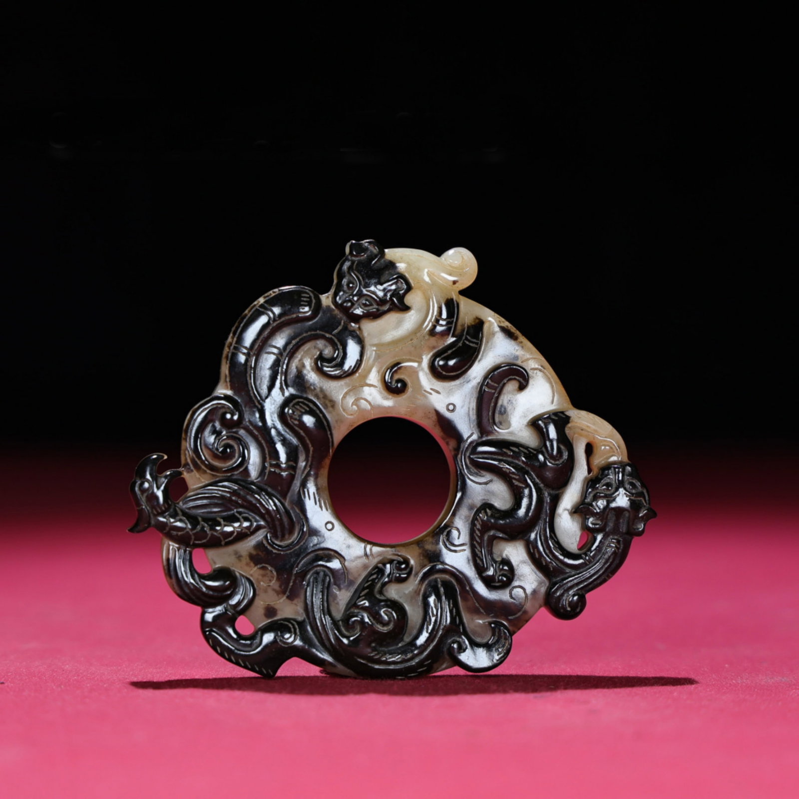 A Chinese Carved Jade Dragon Pendant: Lg. 8.8cm, Wd. 7.3cm, Th. 1.1cm, Wt. 85g