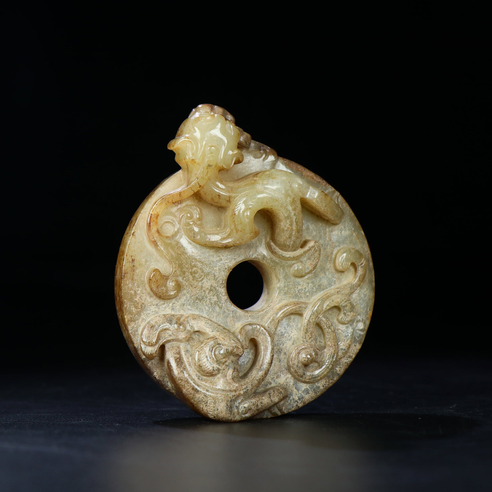 A Chinese Carved Jade Dragon Pendant: Ht. 8.3cm, Wd. 7cm, Wt. 143g