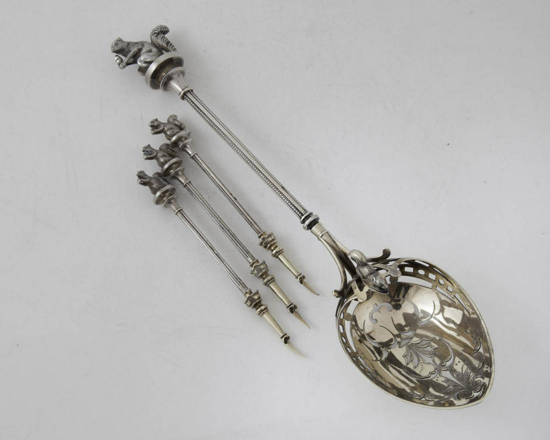 George Sharp Parcel Gilt Silver Nut Set 1865 5 Pieces: Partial Gilt Silver Nut Set George Sharp circa 1865 with two squirrels and angel face in scoop and four squirrel nutpicks. Excellent condition 5 pieces, 4 3/4" nut Picks 10" nut scoop 7.5toz.