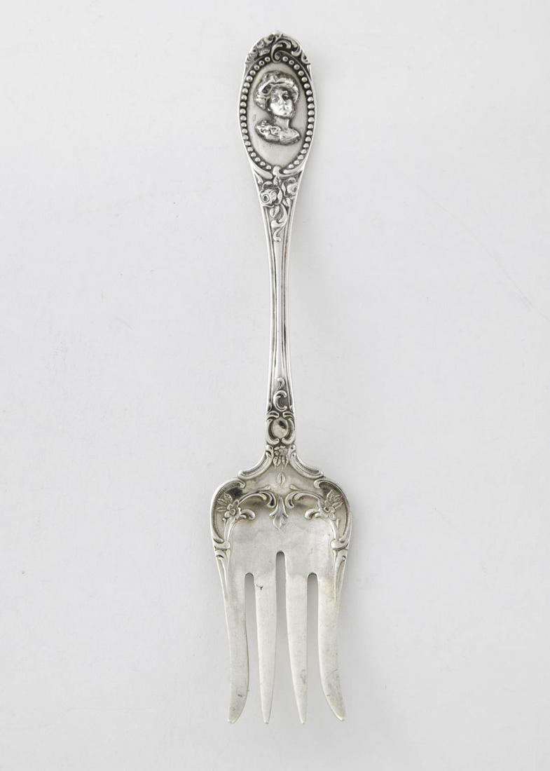 Rare Medallion by Towle Sterling Fork: Rare medallion by Towle sterling silver fork with portrait of a Gibson Girl, circa 1900. 7"L; 1.18toz