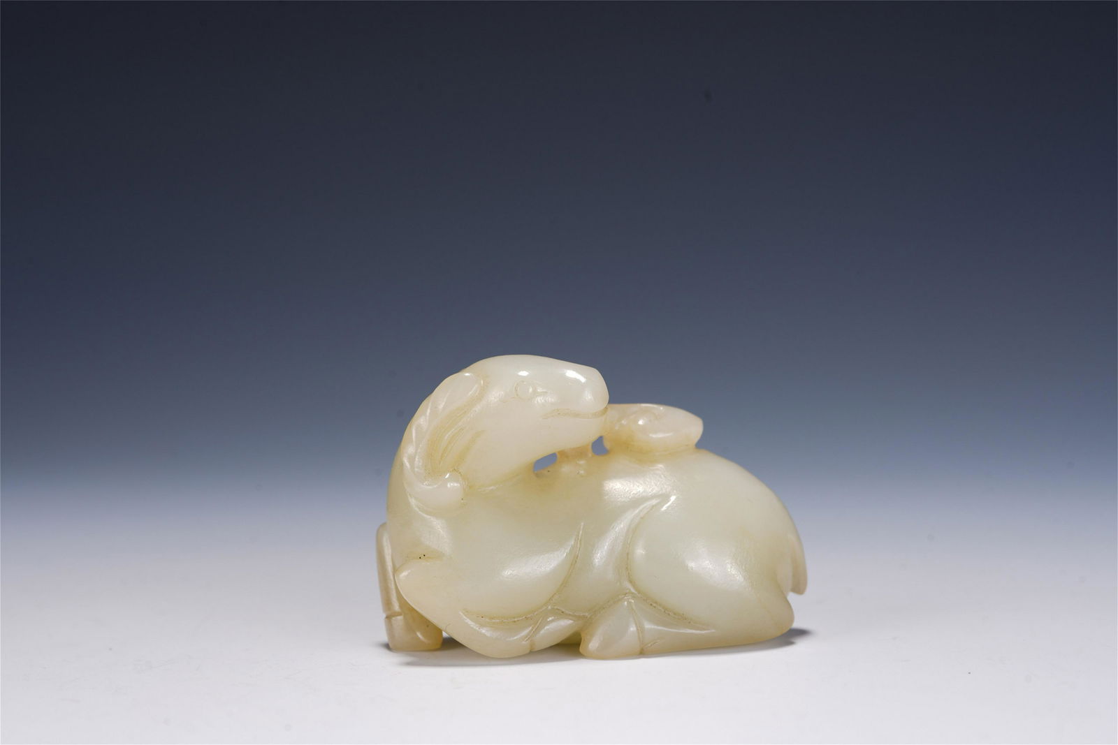A CHINESE CARVED WHITE JADE SHEEP-SHAPED PAPERWEIGHT (1 of 9)