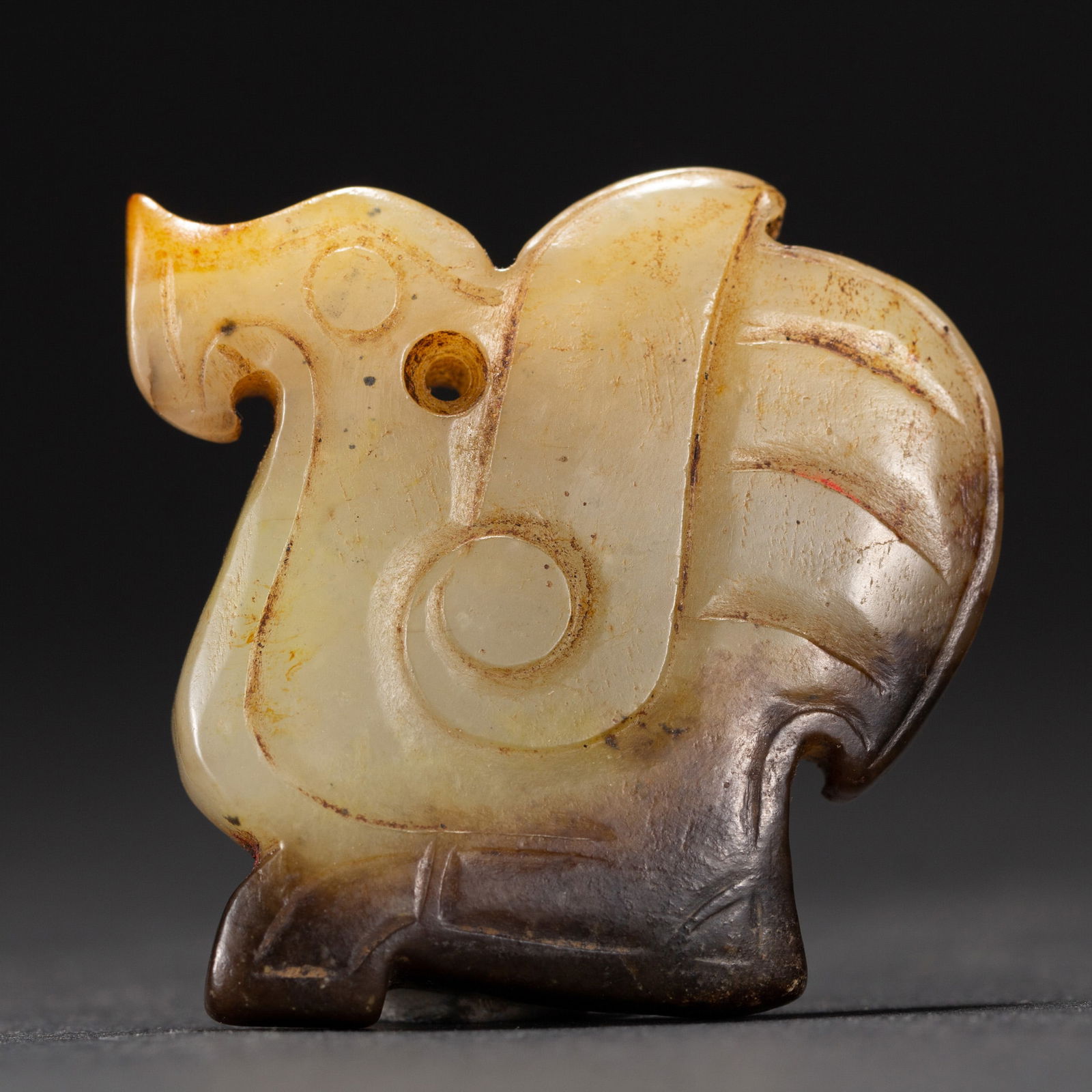 A CHINESE ARCHAISTIC CARVED JADE DISC BI (1 of 6)